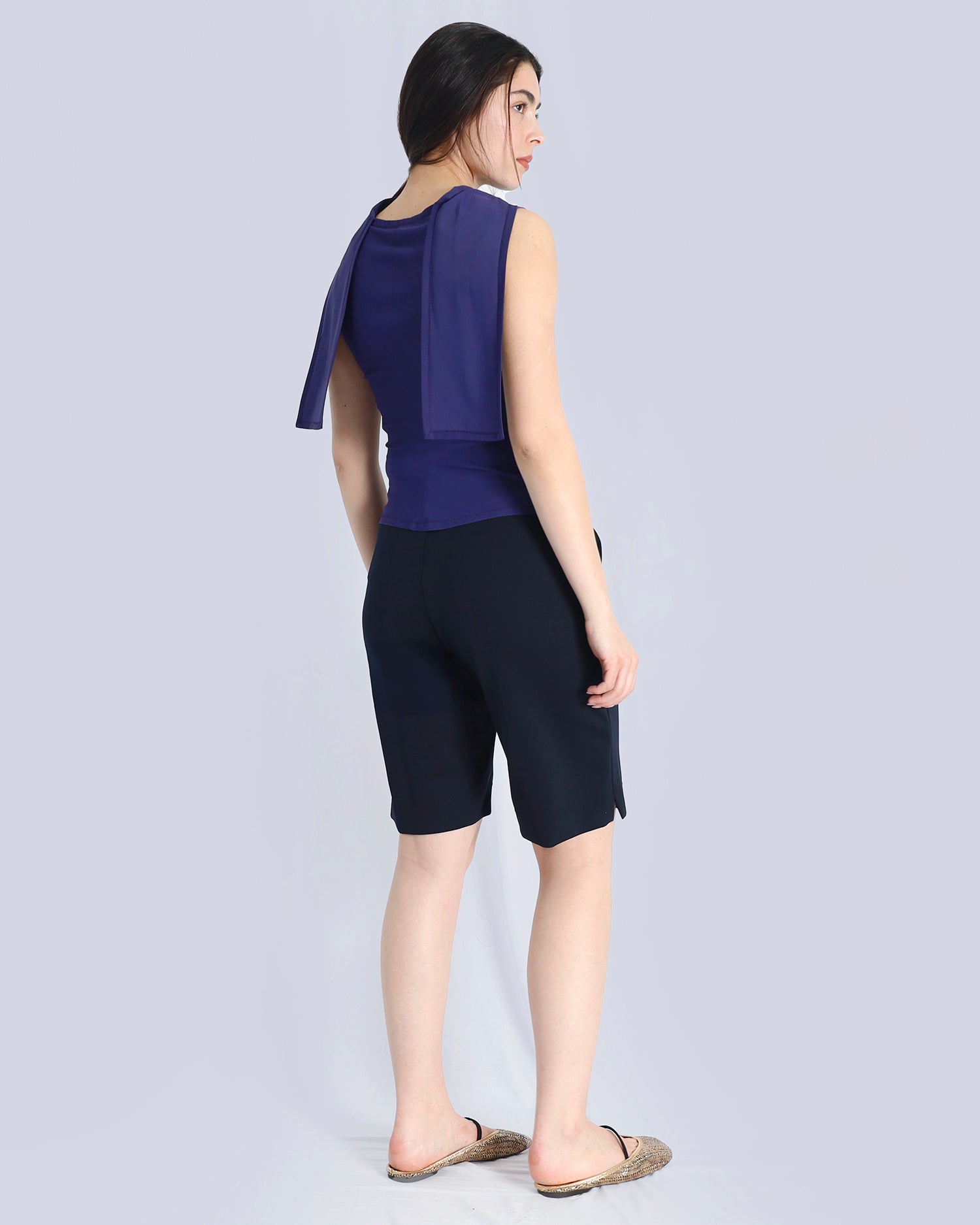 Woman wearing a purple top and black shorts on a light gray background. Maison Marie Saint Pierre | Pants | AVALON2 | Black | Top | PAYTON | Hunter 
