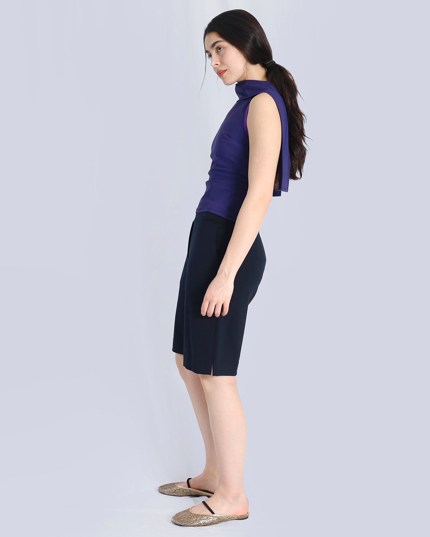 Woman wearing a sleeveless purple top and black skirt on a light gray background. Maison Marie Saint Pierre | Pants | AVALON2 | Black | Top | PAYTON | Hunter 