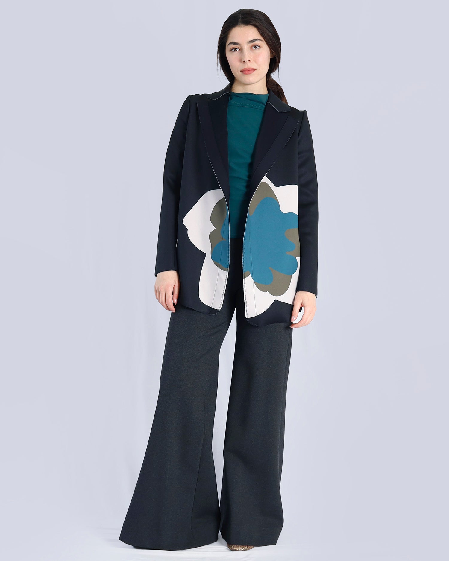 Woman wearing a black coat with floral patterns on a light gray background. Maison Marie Saint Pierre | Pants | AVALON2 | GMI | Jacket | PAOLO2 | Black Wisteria Macro | Top | PAYTON | HUN