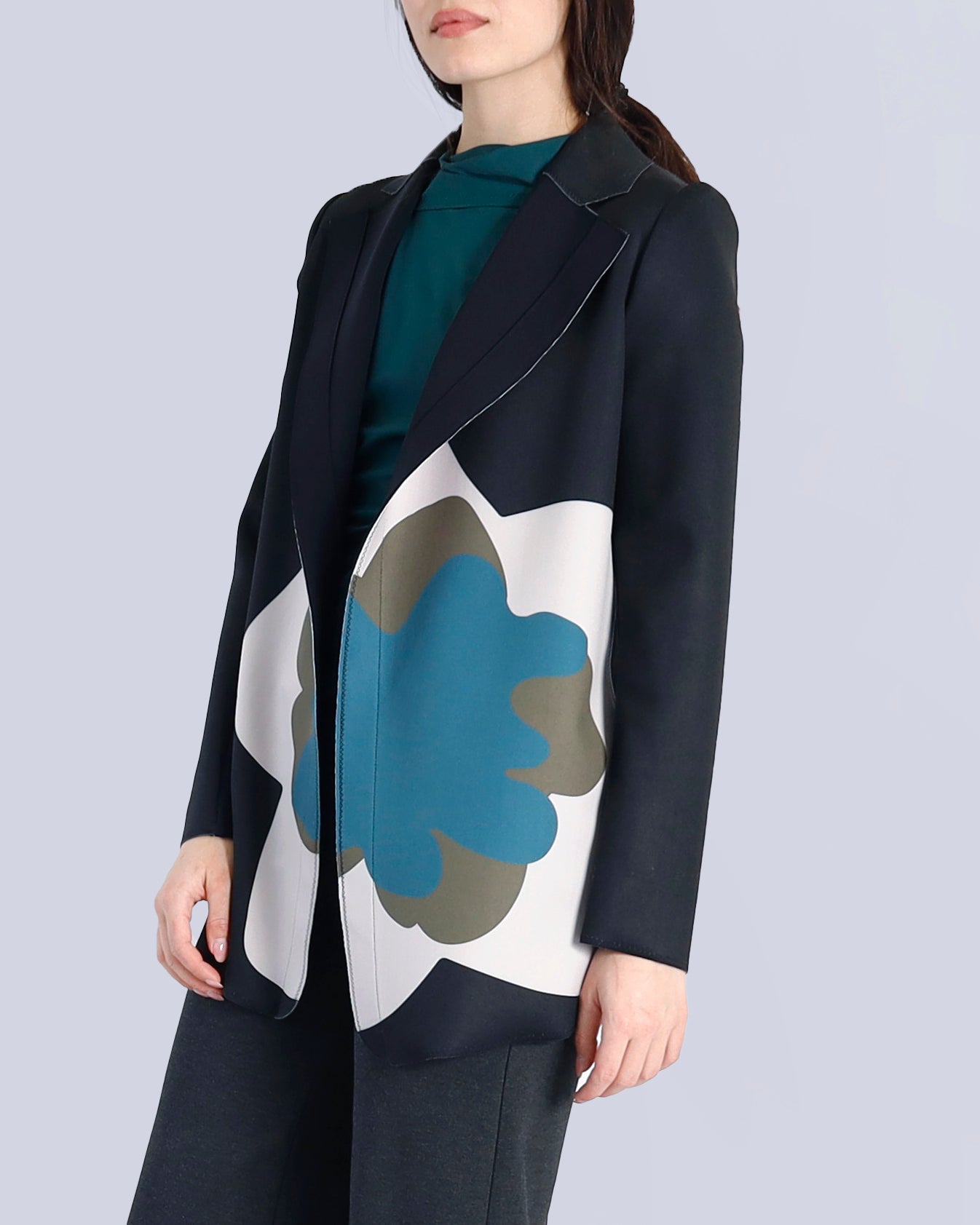Woman wearing a black coat with a floral pattern on a light gray background. Maison Marie Saint Pierre | Pants | AVALON2 | GMI | Jacket | PAOLO2 | Black Wisteria Macro | Top | PAYTON | HUN