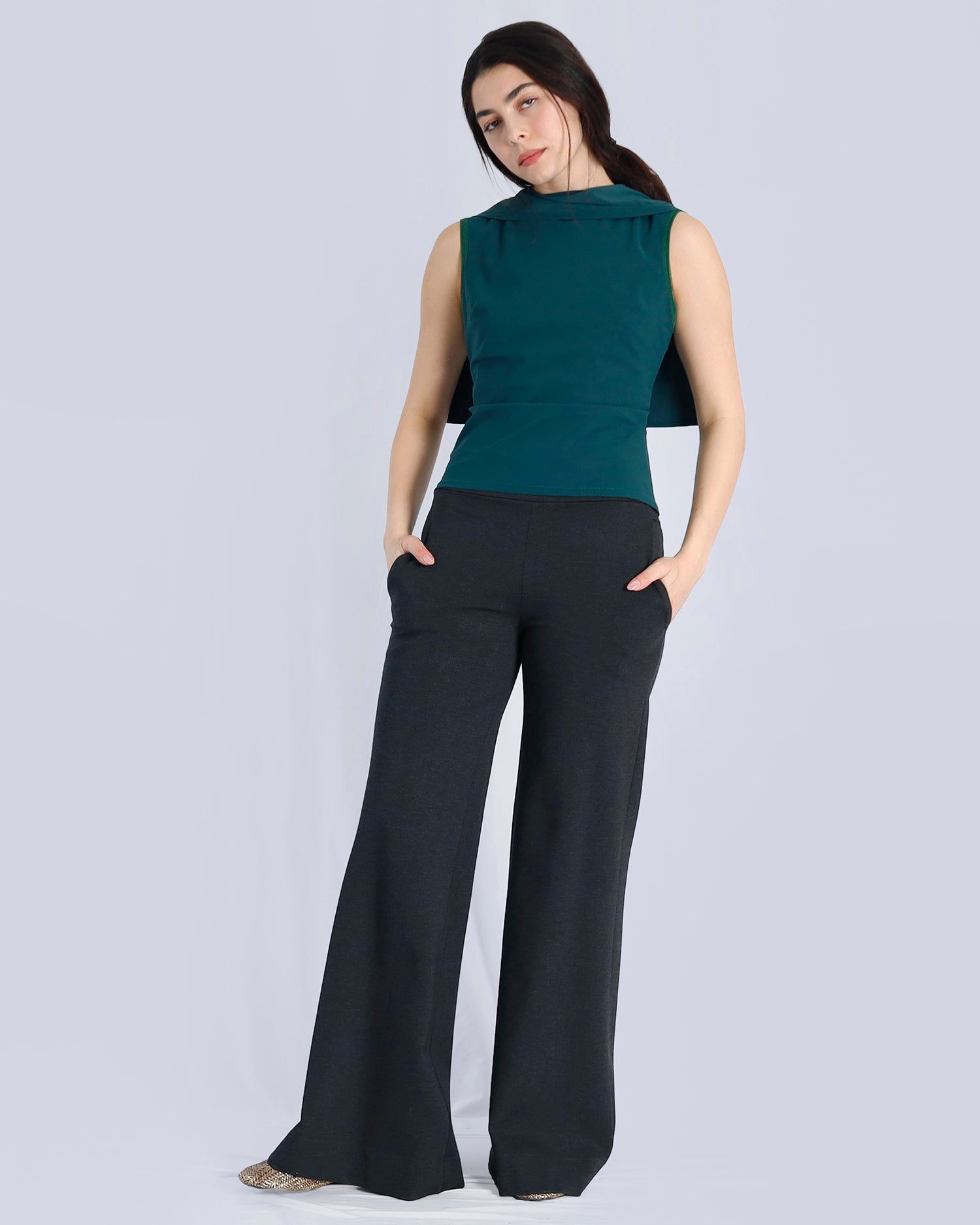 Woman wearing a green sleeveless top and black pants on a light gray background. Maison Marie Saint Pierre | Pants | AVALON2 | Black | Top | PAYTON | Hunter 