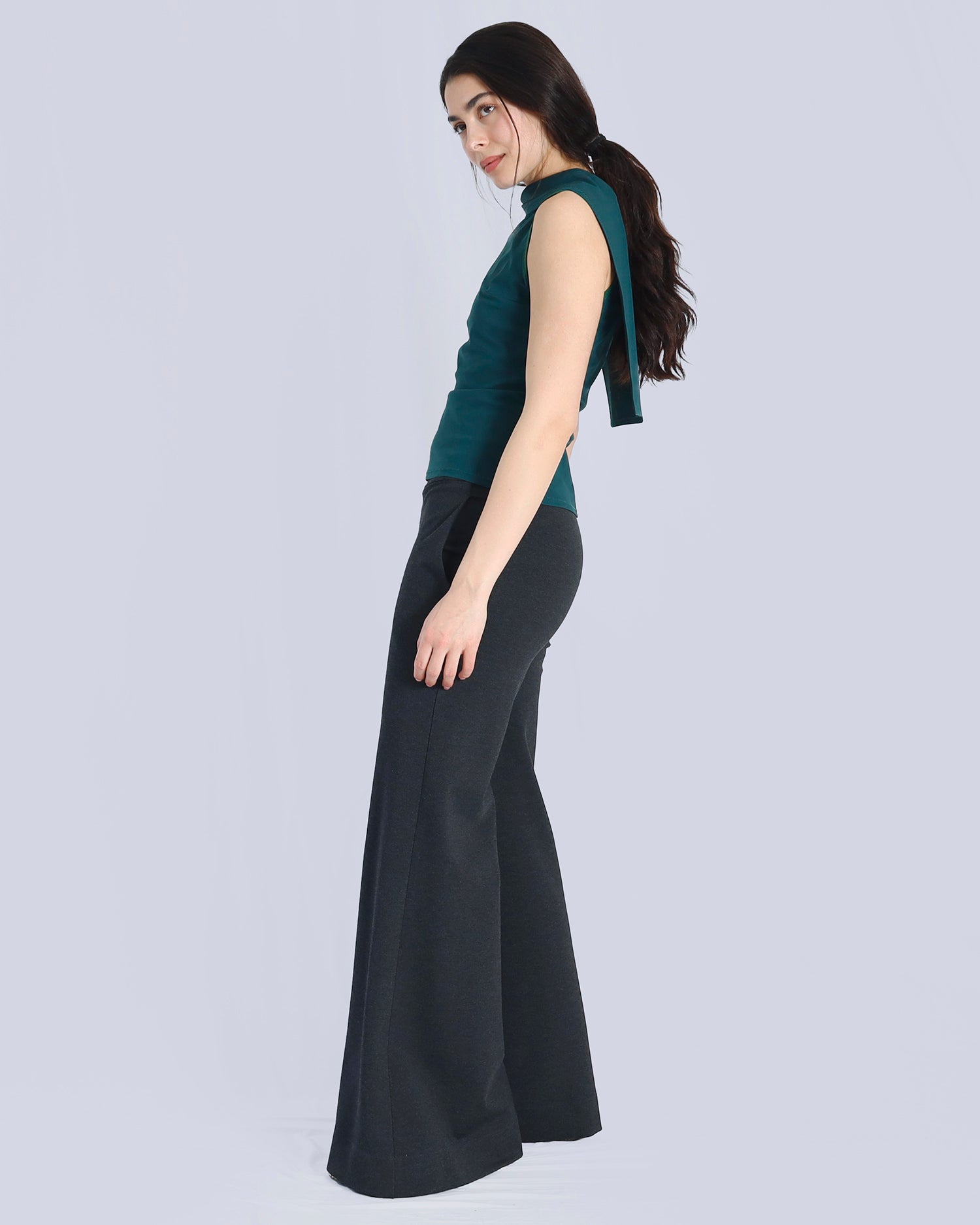 Woman wearing a green top and black pants on a light gray background. Maison Marie Saint Pierre | Pants | AVALON2 | Black | Top | PAYTON | Hunter 