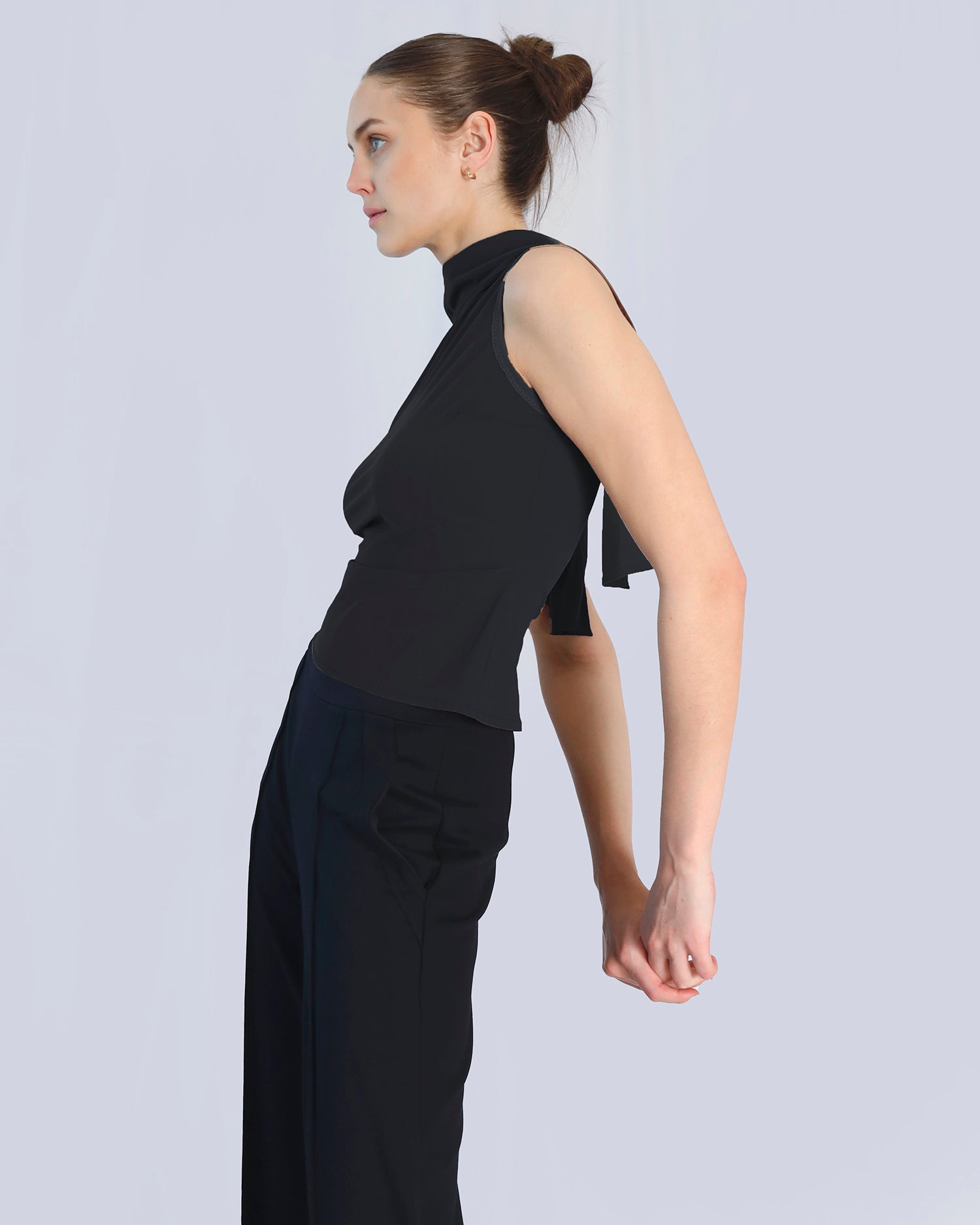 Woman wearing a black sleeveless top and black pants on a light gray background. Maison Marie Saint Pierre | Pants | DELMIRA2 | Black | Top | PAYTON | Black 