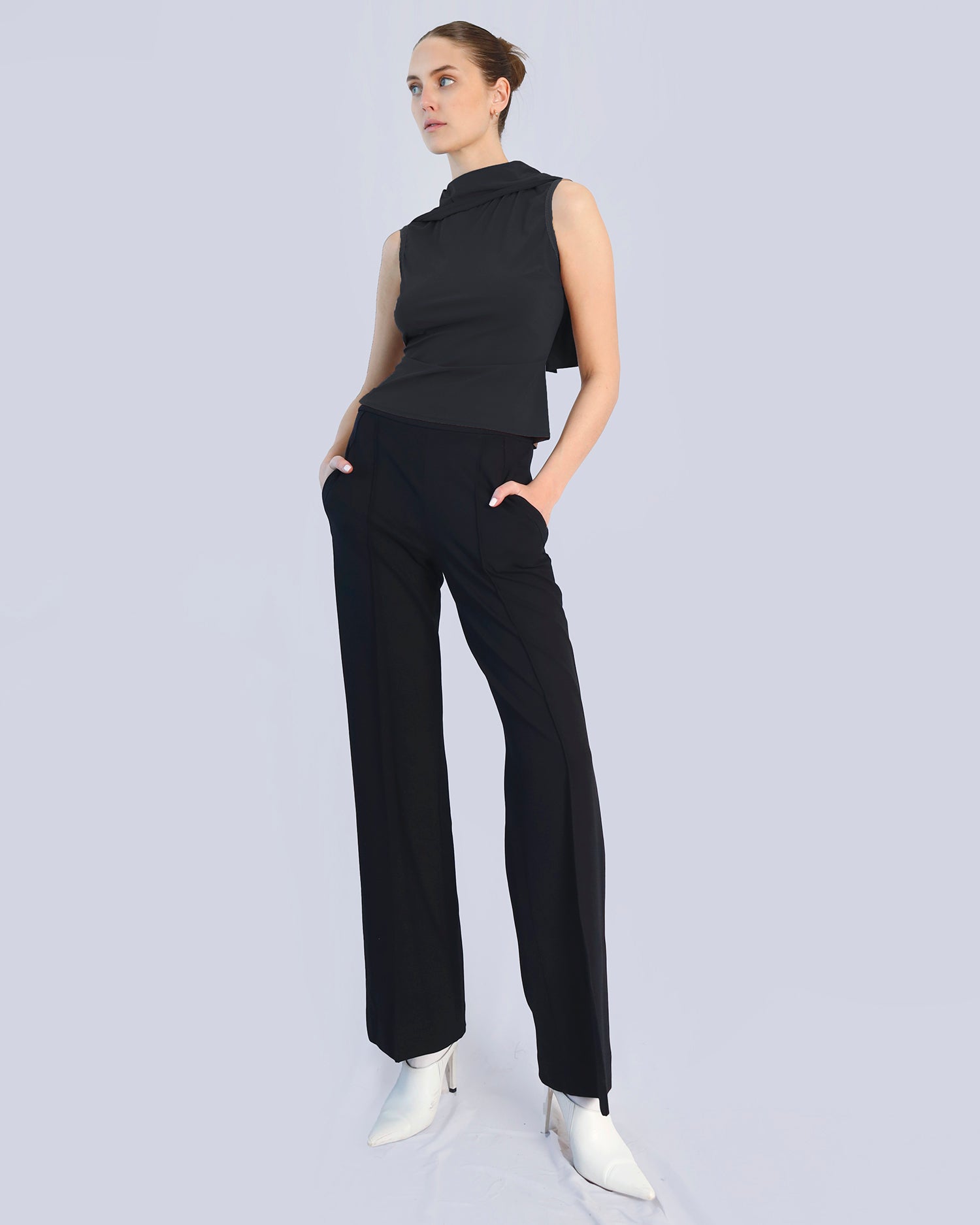 Woman wearing a black sleeveless top and pants on a light gray background. Maison Marie Saint Pierre | Pants | DELMIRA2 | Black | Top | PAYTON | Black 
