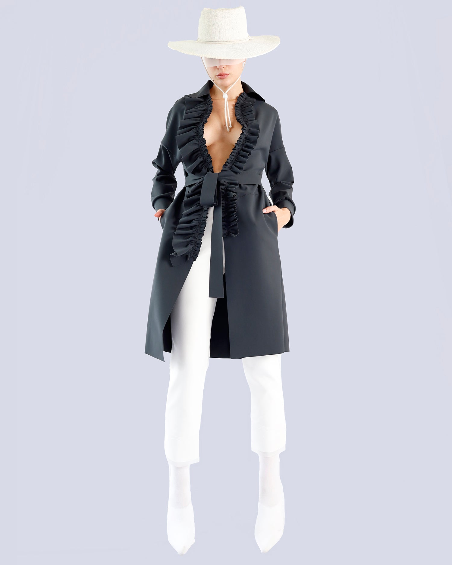 Person wearing a black coat with ruffles, white pants, and a white hat on a light gray background. Maison Marie Saint Pierre | Coat | PELLINAME | ANT