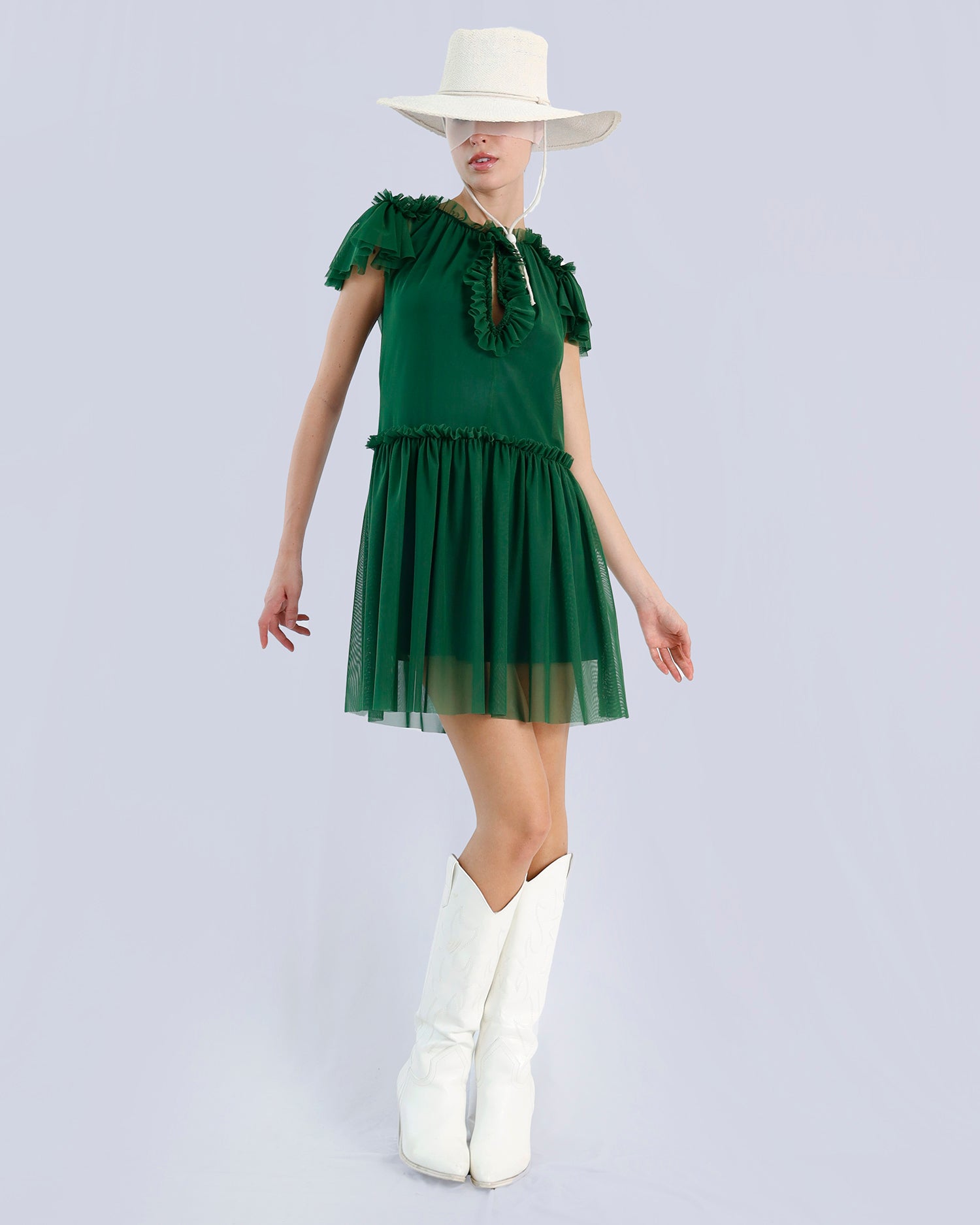 Woman wearing a green dress with ruffled details and white boots on a light gray background Maison Marie Saint Pierre | Dress | PÉTIA |  Evergreen