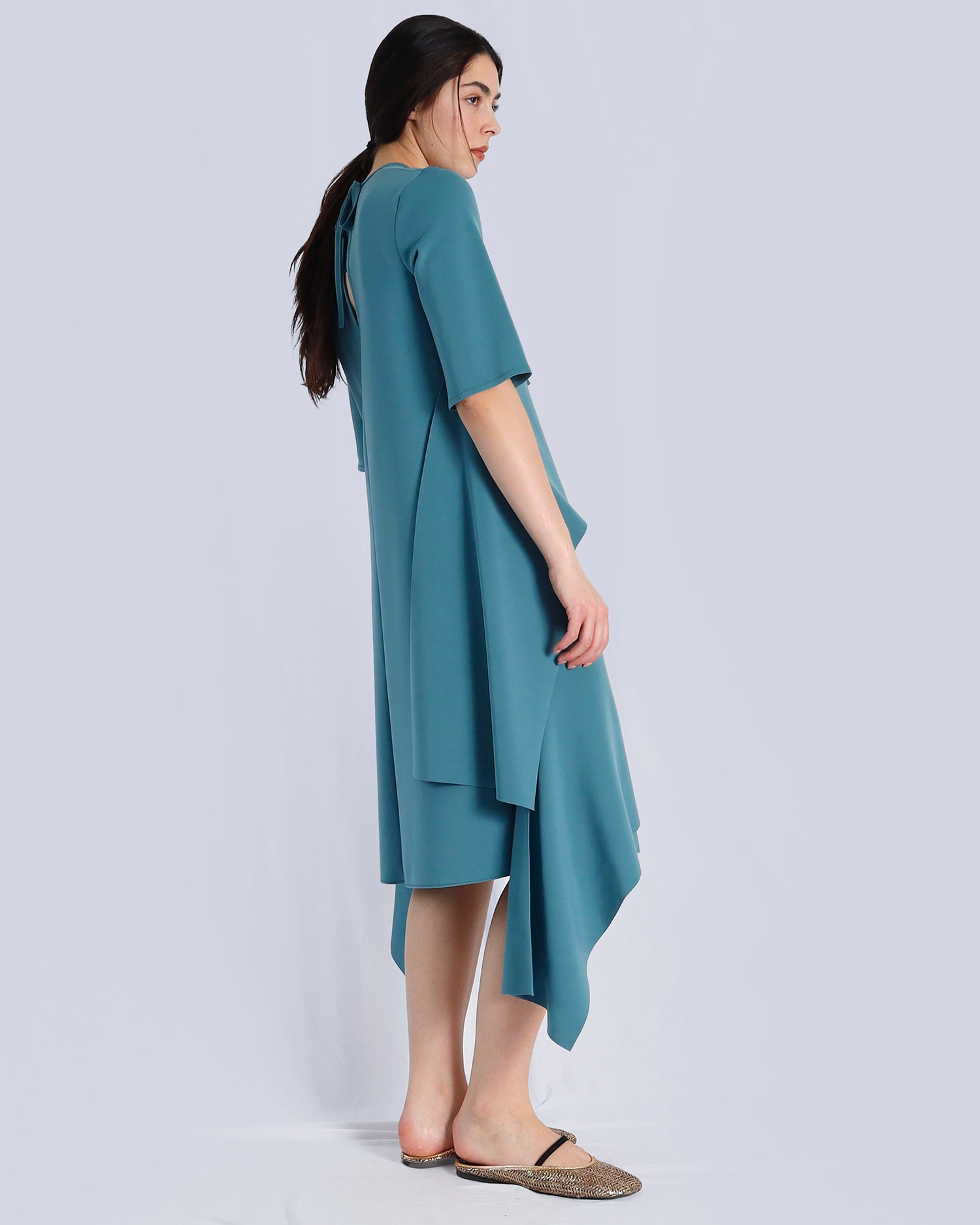 Woman wearing a teal dress on a light gray background. Maison Marie Saint Pierre | Dress | PRISCA | Conifer