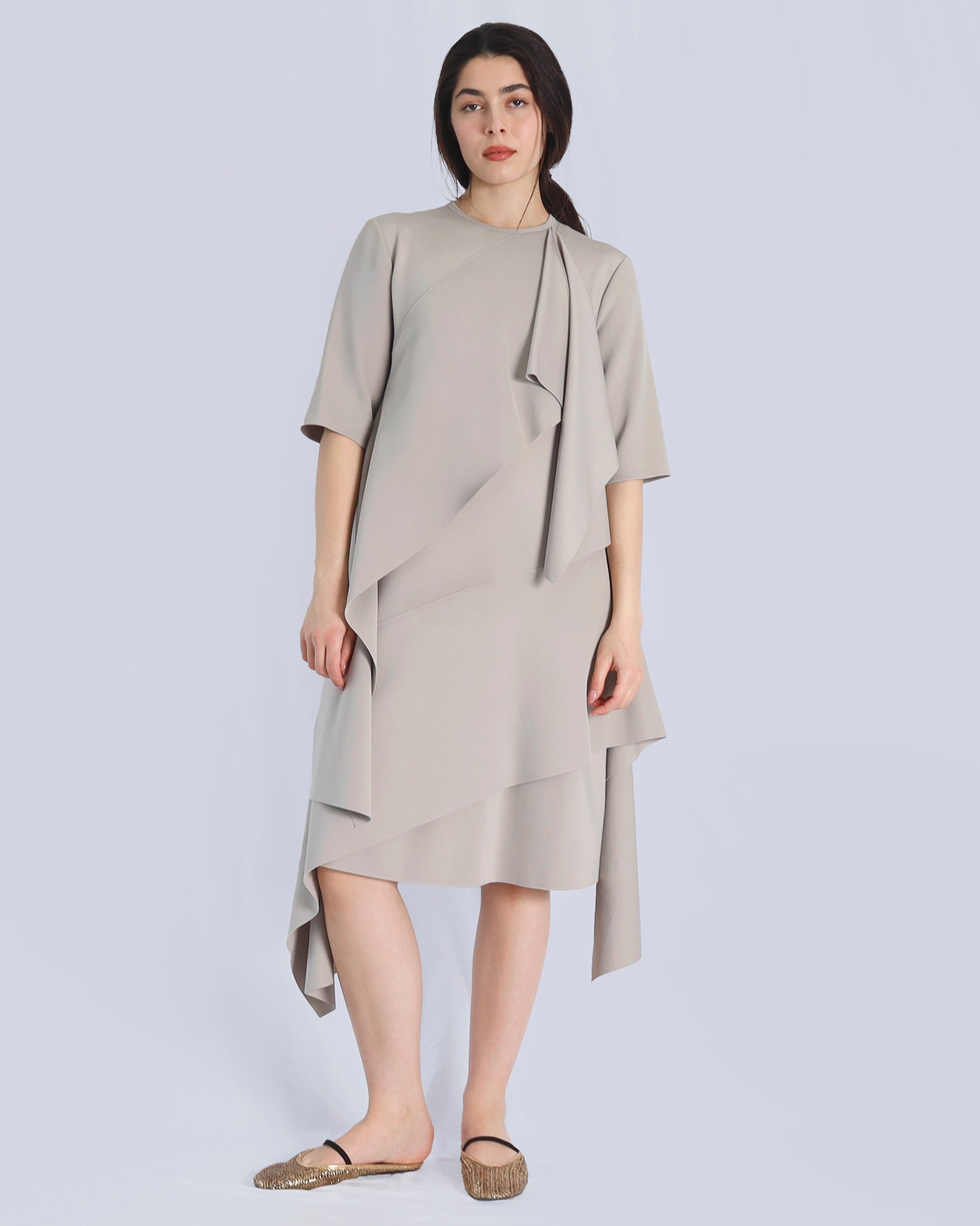 Woman wearing a beige dress with a plain background. Maison Marie Saint Pierre | Dress | PRISCA | Fog