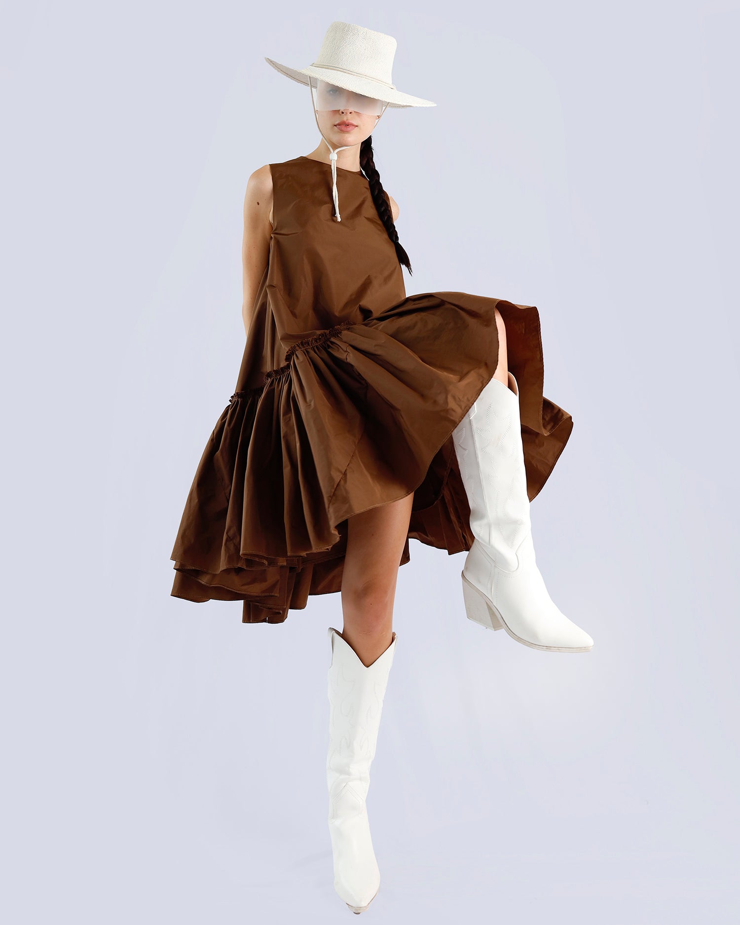 Person wearing a brown dress and white boots on a light gray background. Maison Marie Saint Pierre | Dress | PENSEE |  Dark Umber 
