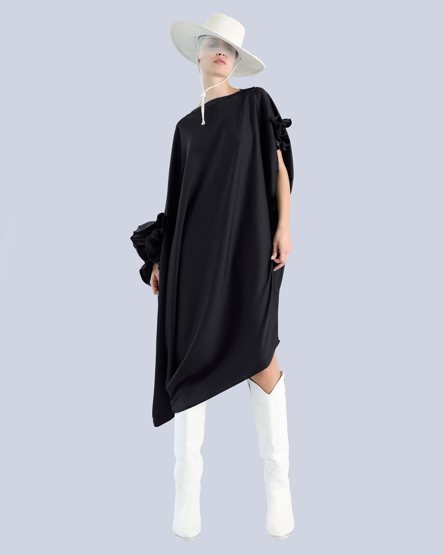 Person wearing a black dress with white boots and a white hat on a light gray background. Maison Marie Saint Pierre | Dress | PHASME | Black 