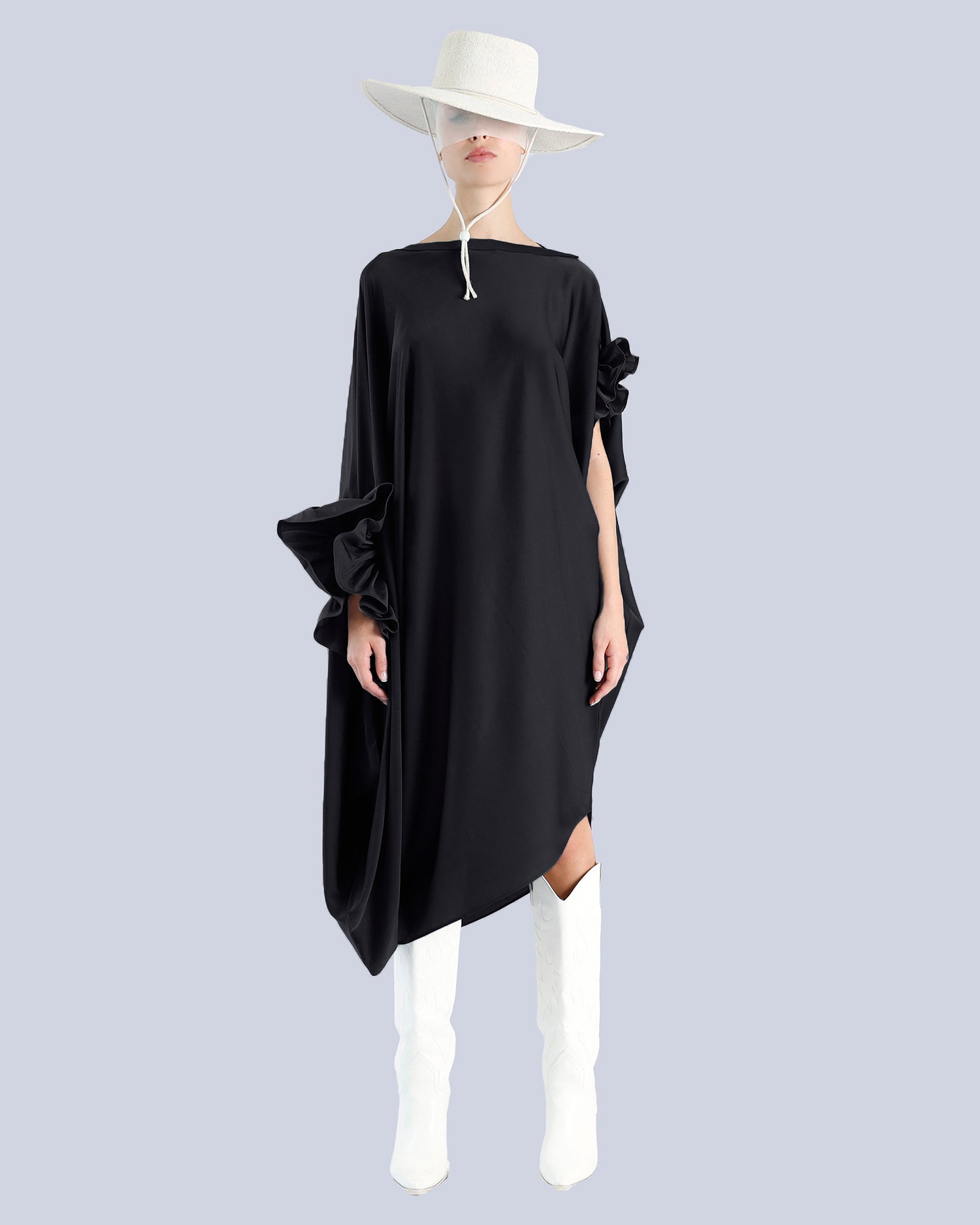 Person wearing a black dress with white boots and a white hat on a light gray background. Maison Marie Saint Pierre | Dress | PHASME | Black 