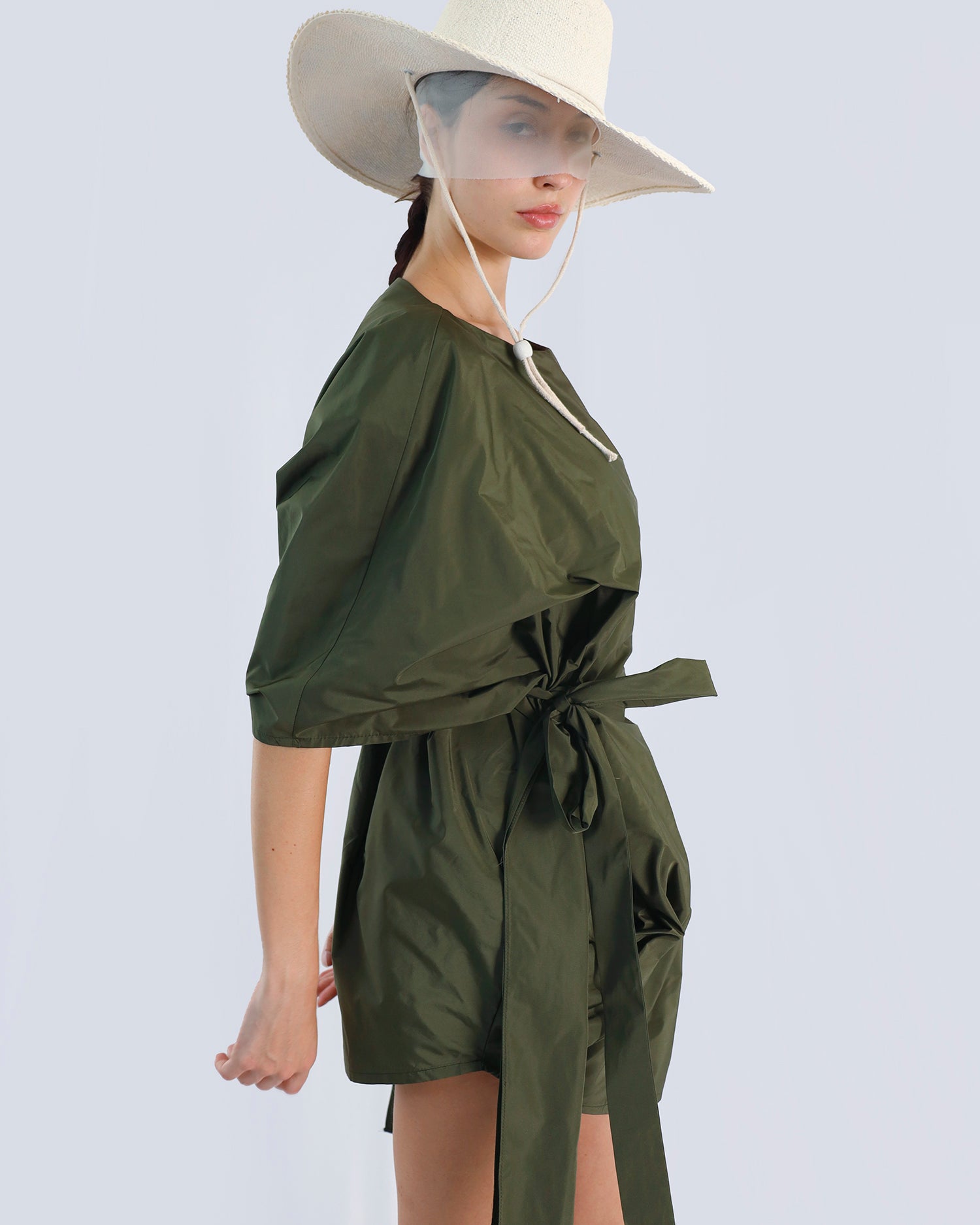 Person wearing an olive green dress with a wide-brimmed hat on a light gray background. Maison Marie Saint Pierre | Dress | PHAENNE |  Kaki