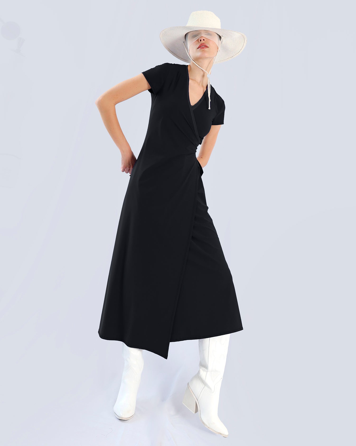 Person wearing a black dress and white hat on a light gray background. Maison Marie Saint Pierre | Dress | PAMANA | Black 