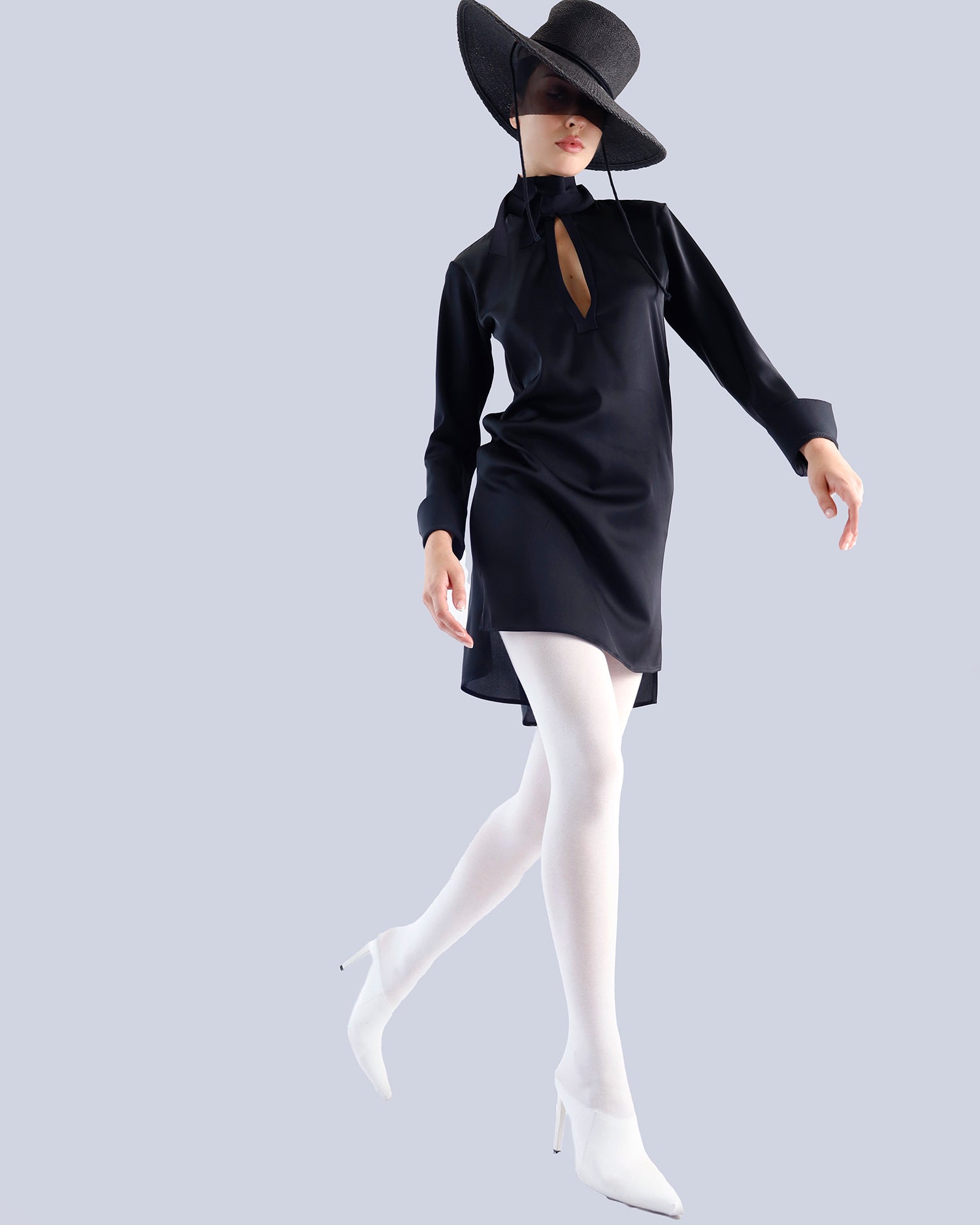 Person wearing a black dress, white stockings, and a wide-brimmed hat on a light gray background. Maison Marie Saint Pierre | Dress | PATTI | Black 