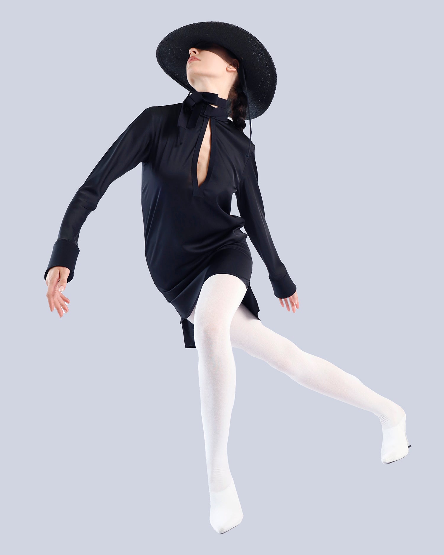 Mannequin wearing a black dress with a deep neckline and a wide-brimmed black hat on a light gray background.. Maison Marie Saint Pierre | Dress | PATTI | Black 