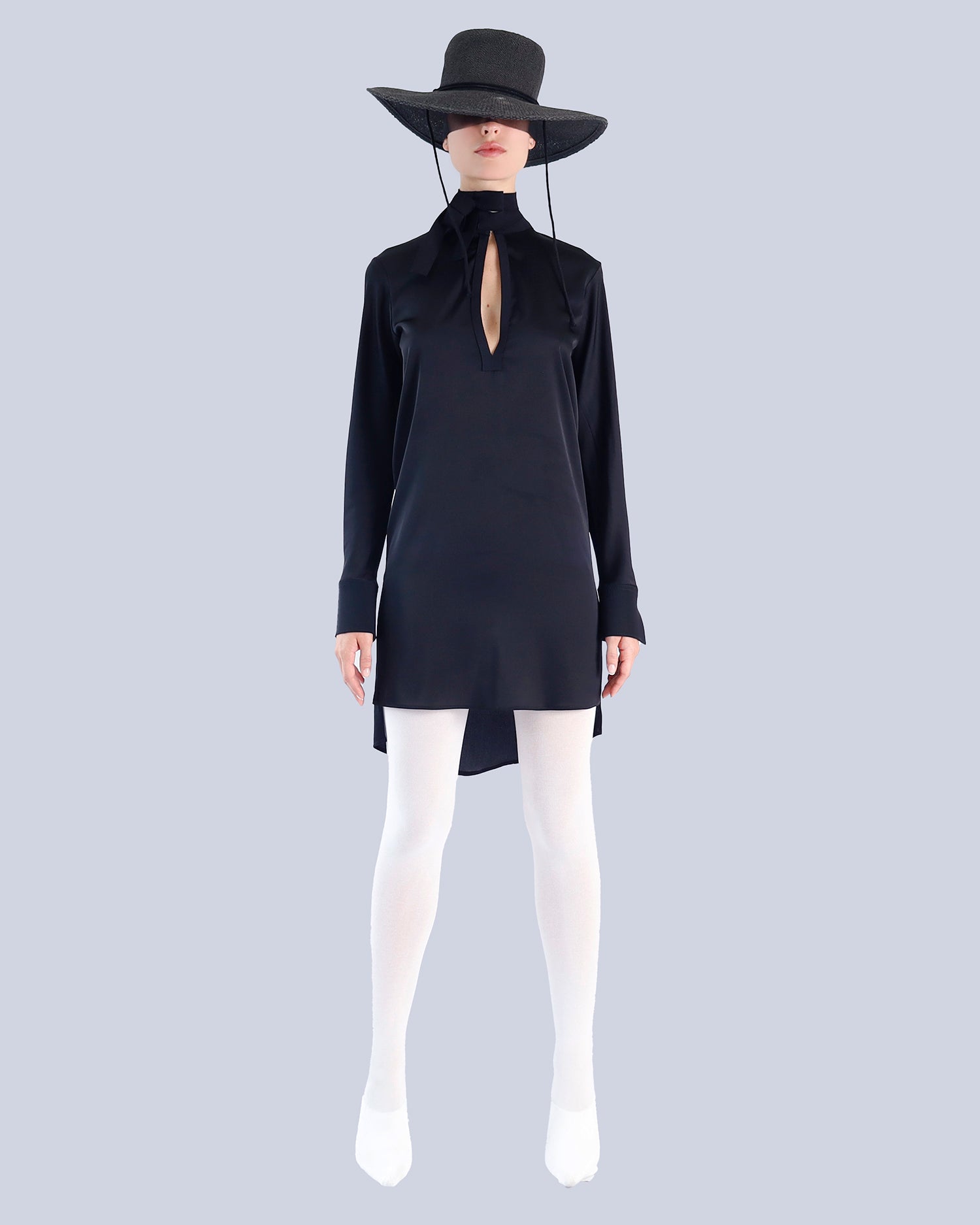 Person wearing a black dress with a high collar and long sleeves, paired with a wide-brimmed black hat on a light gray background. Maison Marie Saint Pierre | Dress | PATTI | Black 