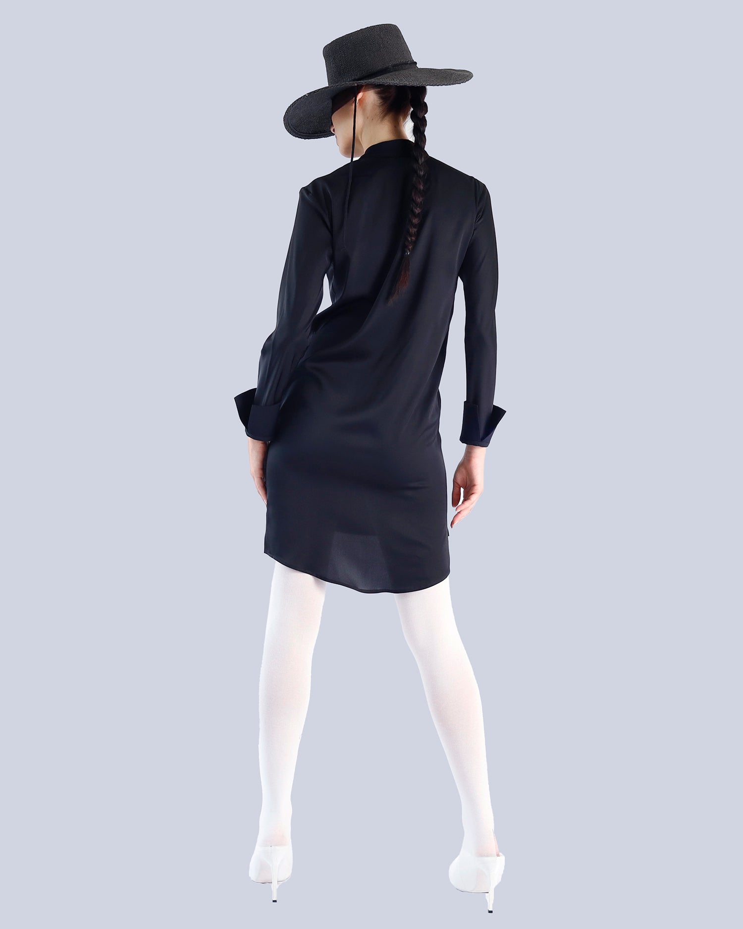 Person wearing a black dress and hat from behind on a light gray background. Maison Marie Saint Pierre | Dress | PATTI | Black 