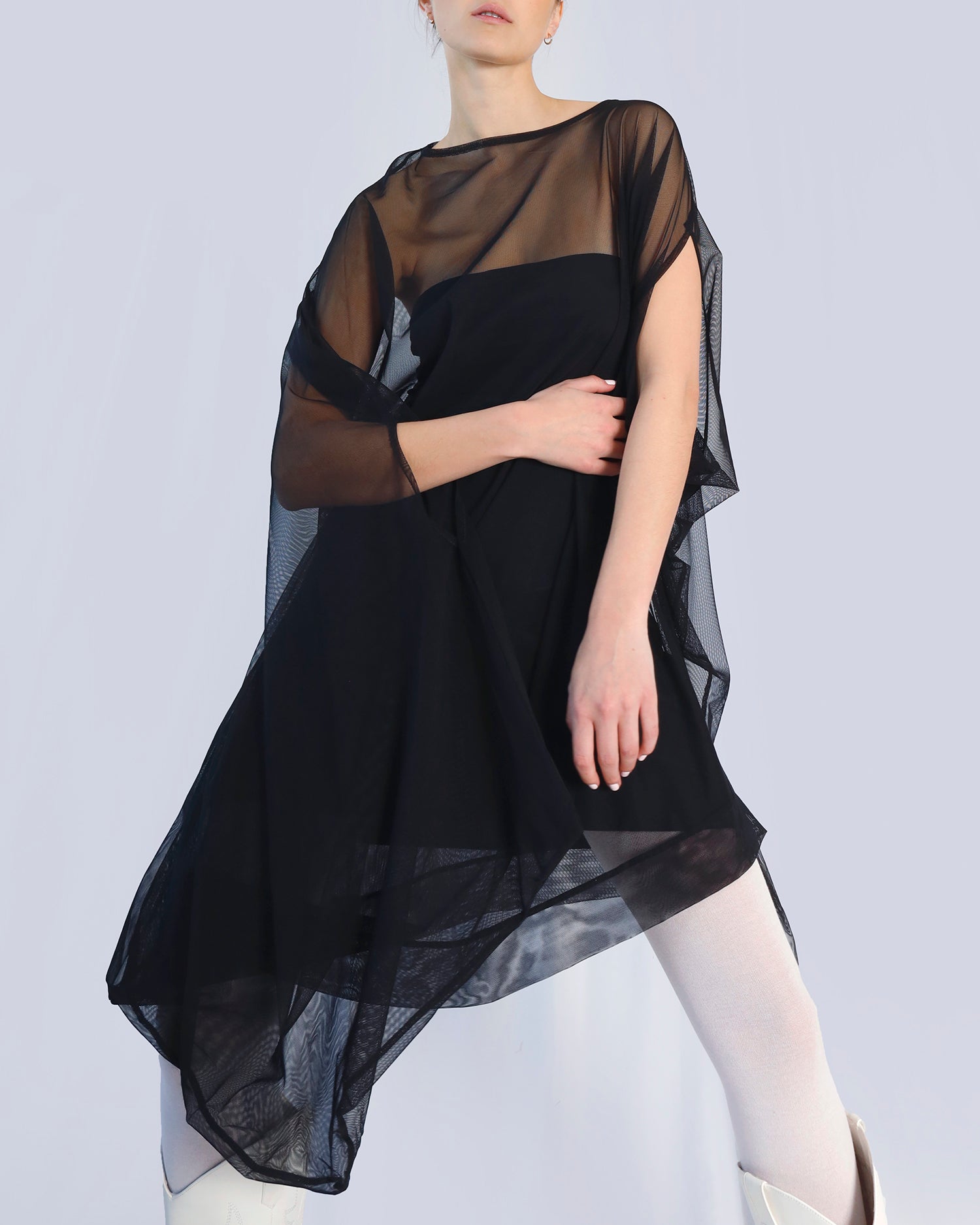 Black sheer dress worn by a model on a light gray background. Maison Marie Saint Pierre | Dress | PHASMINA | Black