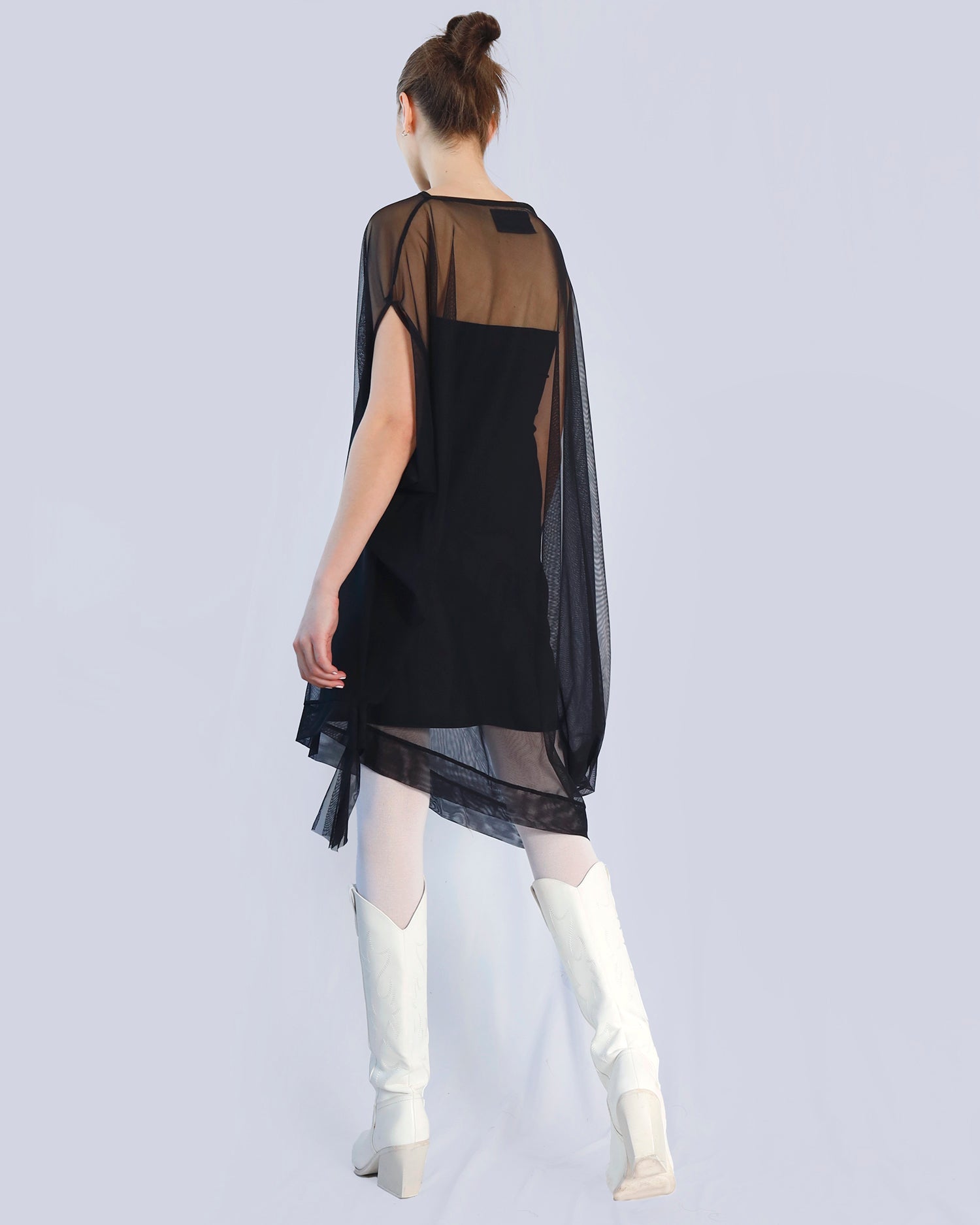 Person wearing a black dress with sheer panels on a light gray background. Maison Marie Saint Pierre | Dress | PHASMINA | Black