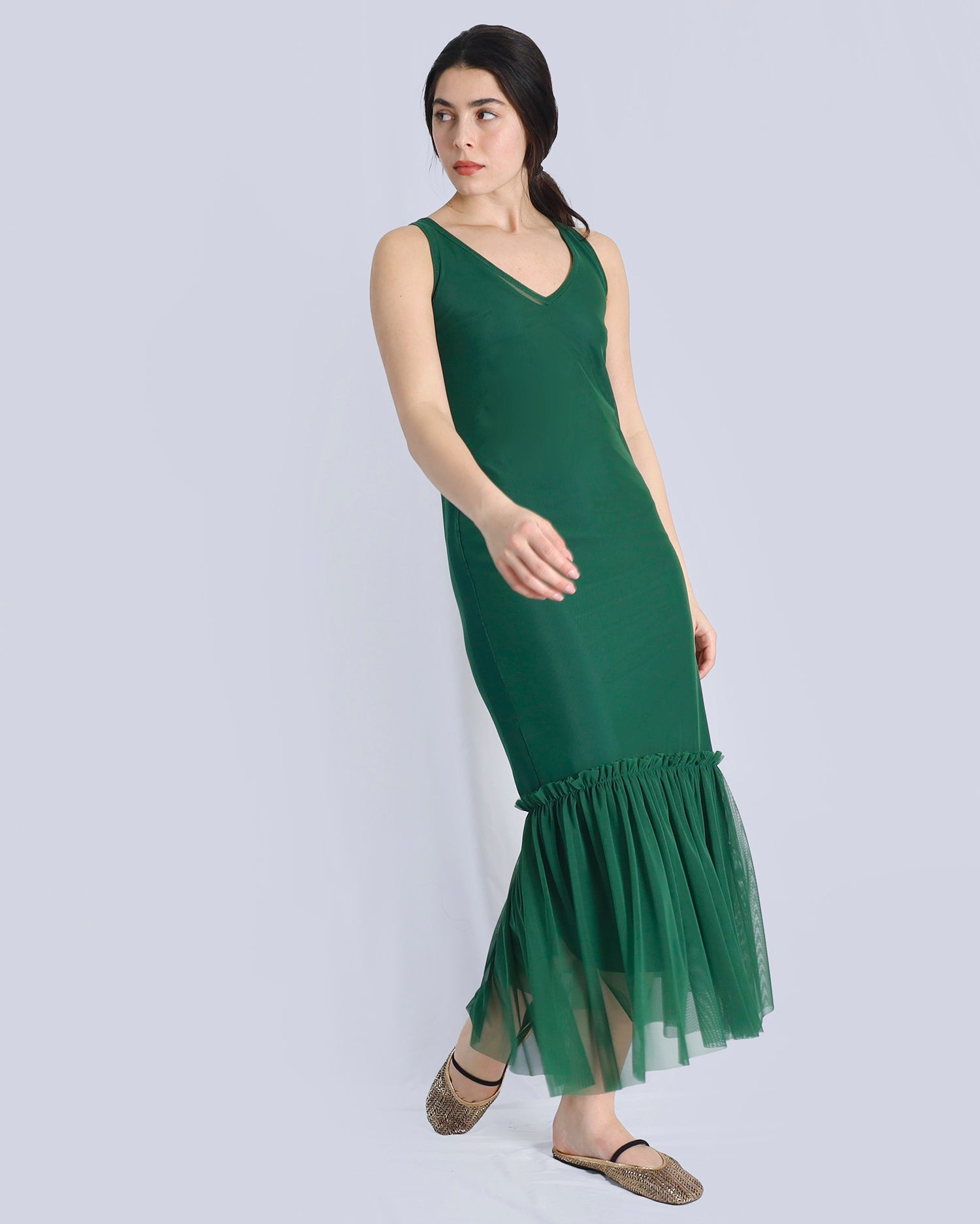 Woman wearing a green dress with a plain background. Maison Marie Saint Pierre | Dress | POLZIN| Evergreen