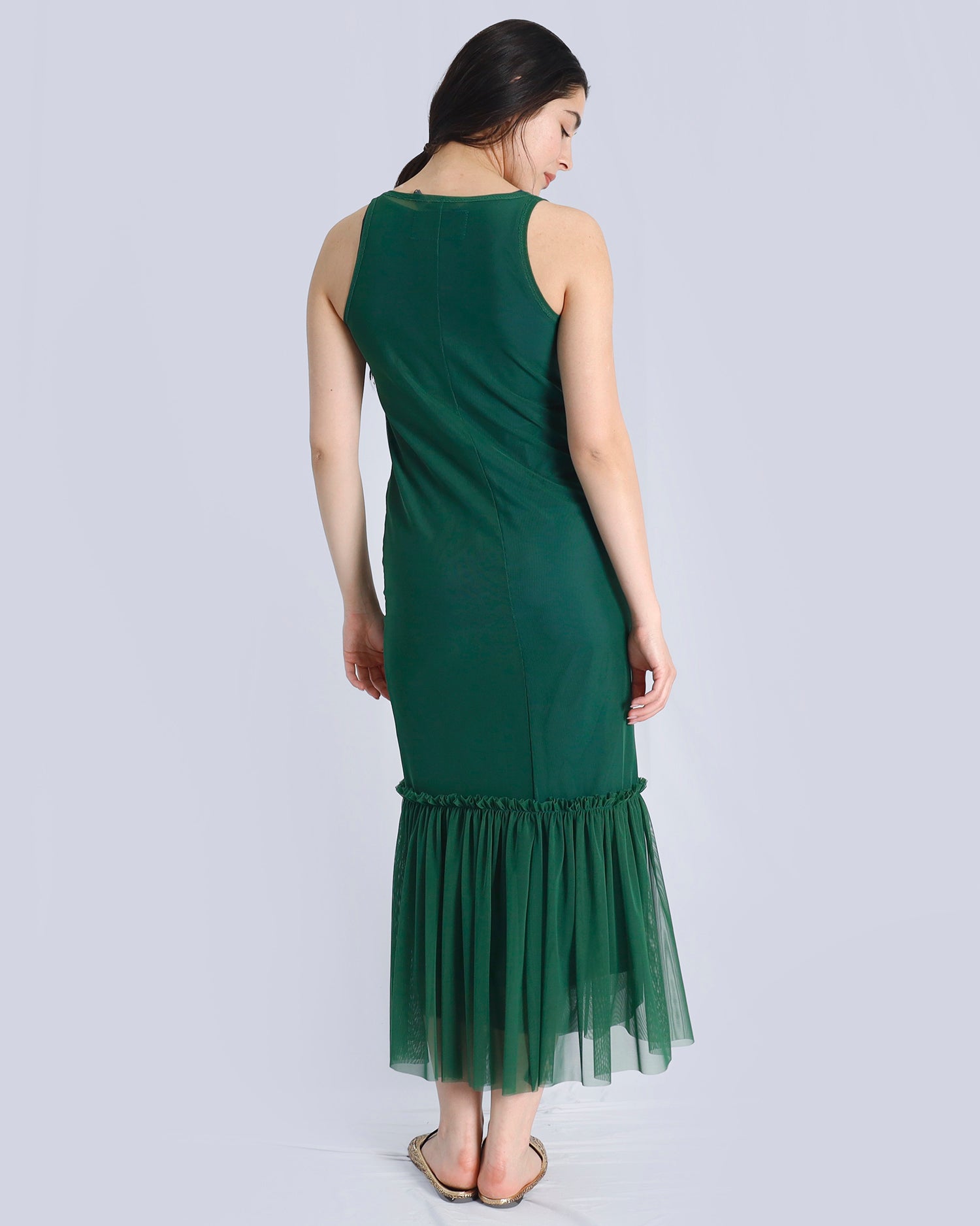 Woman wearing a green dress with a sheer overlay on a white background. Maison Marie Saint Pierre | Dress | POLZIN| Evergreen