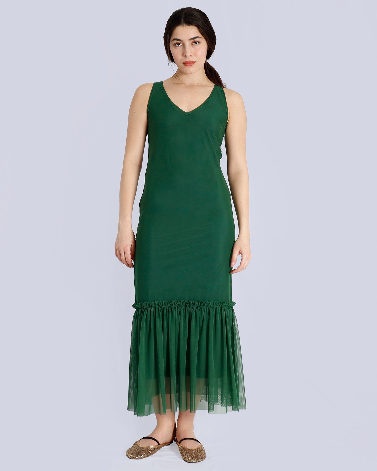 Woman wearing a green dress with a plain background. Maison Marie Saint Pierre | Dress | POLZIN| Evergreen