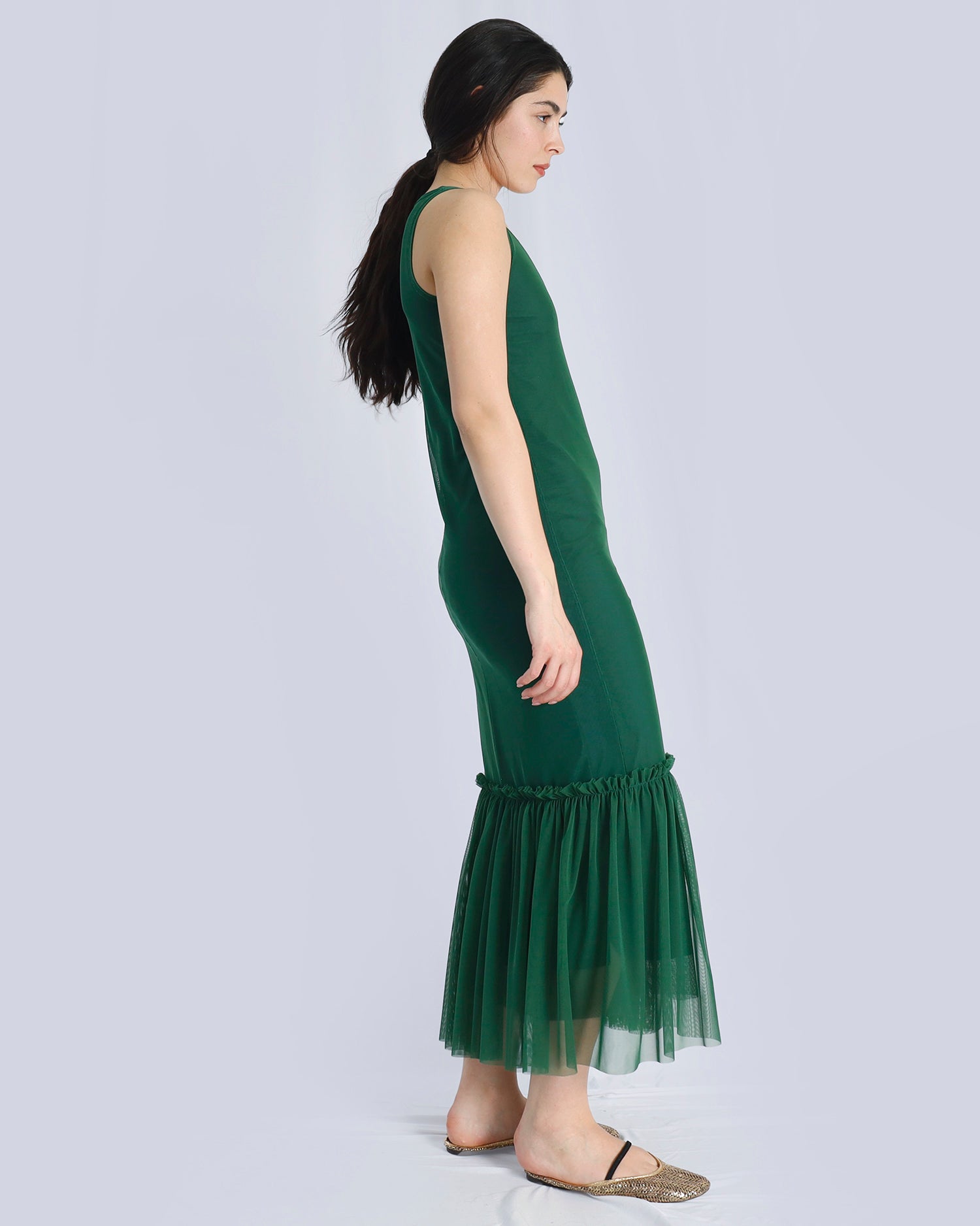 Woman wearing a green dress with a plain background. Maison Marie Saint Pierre | Dress | POLZIN| Evergreen