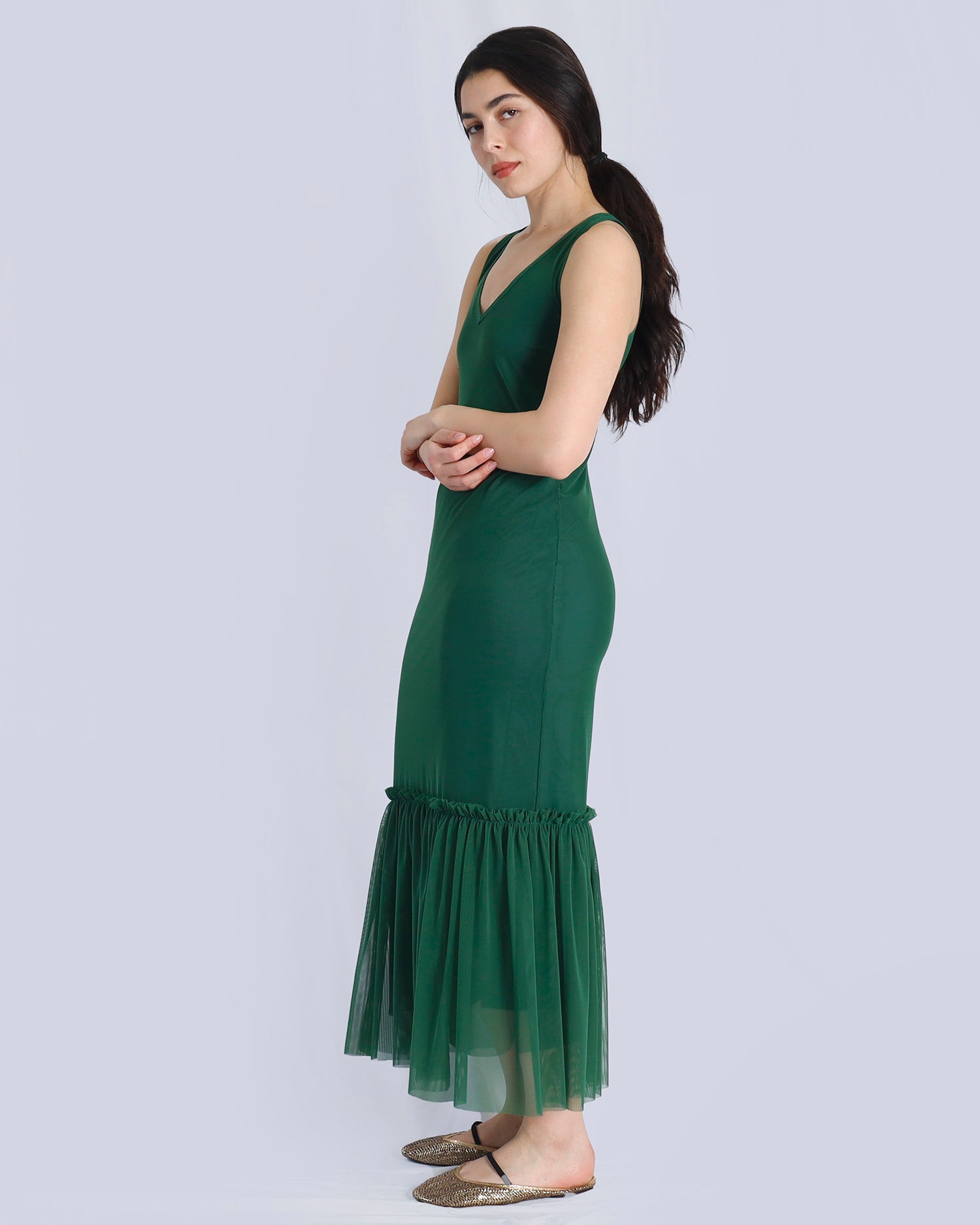 Woman wearing a green dress with a plain background. Maison Marie Saint Pierre | Dress | POLZIN| Evergreen