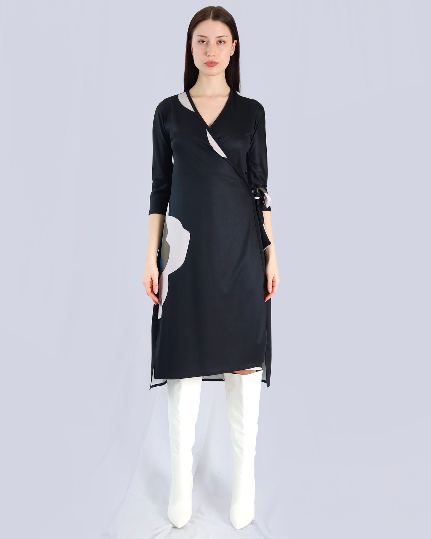 Woman wearing a black dress with white accents on a light gray background. Maison Marie Saint Pierre | Dress | PAISLEY | Black Wisteria Macro