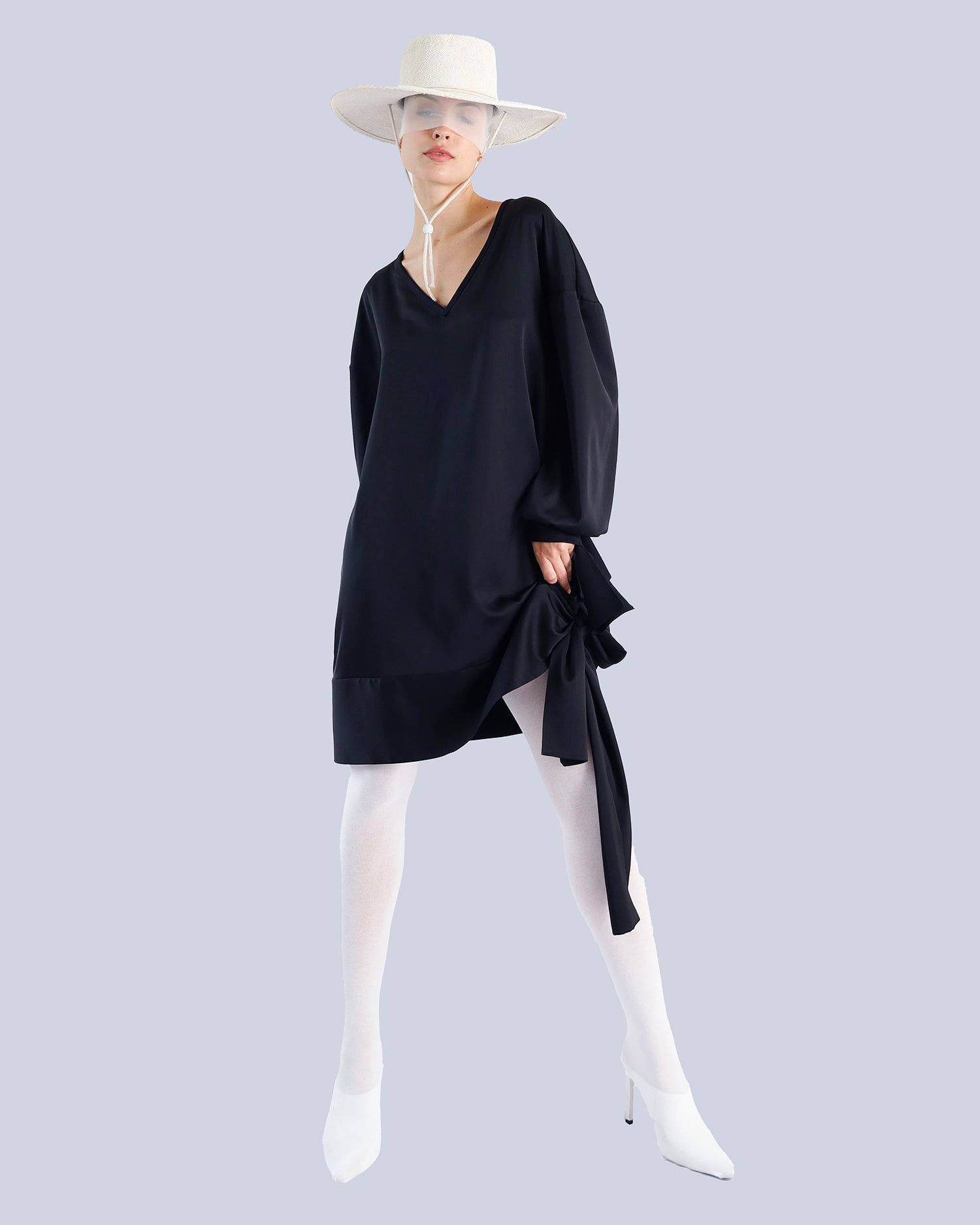 Person wearing a black dress and white shoes on a light gray background. Maison Marie Saint Pierre | Tunique | PELLEGRINA | Black 