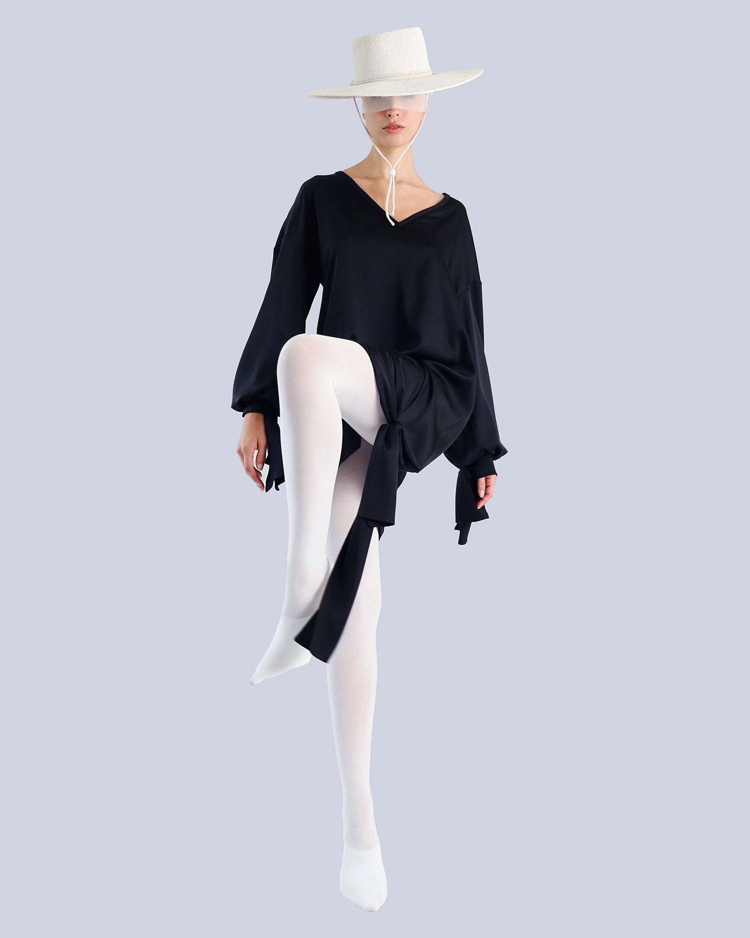 Person wearing a black dress with a white hat on a light gray background. Maison Marie Saint Pierre | Tunique | PELLEGRINA | Black 