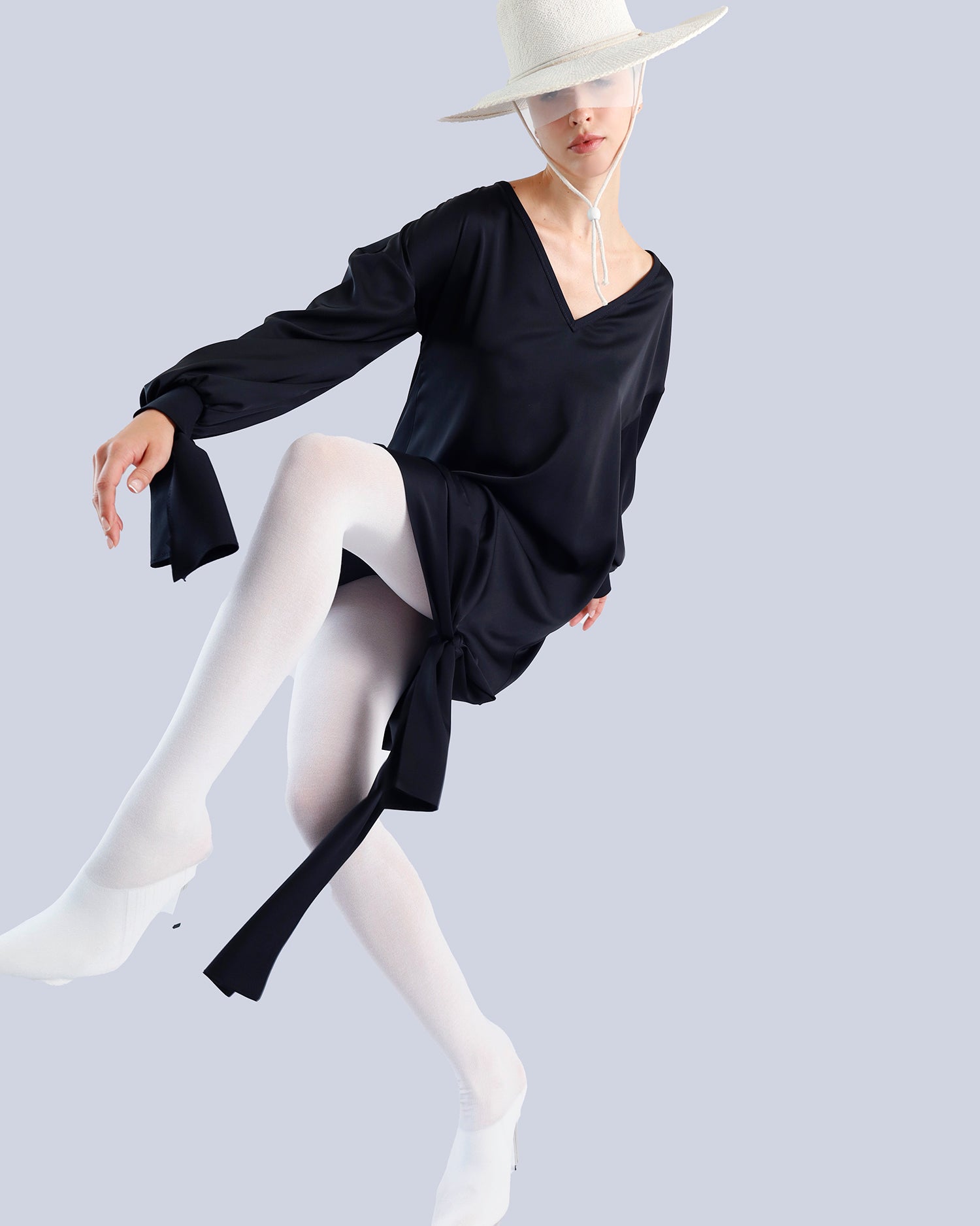 Person wearing a black dress and white stockings on a light gray background. Maison Marie Saint Pierre | Tunique | PELLEGRINA | Black 